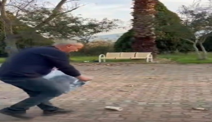 Şehitliğe saygısızlık edip kirletenlerin çöplerini belediye başkanı tek tek topladı