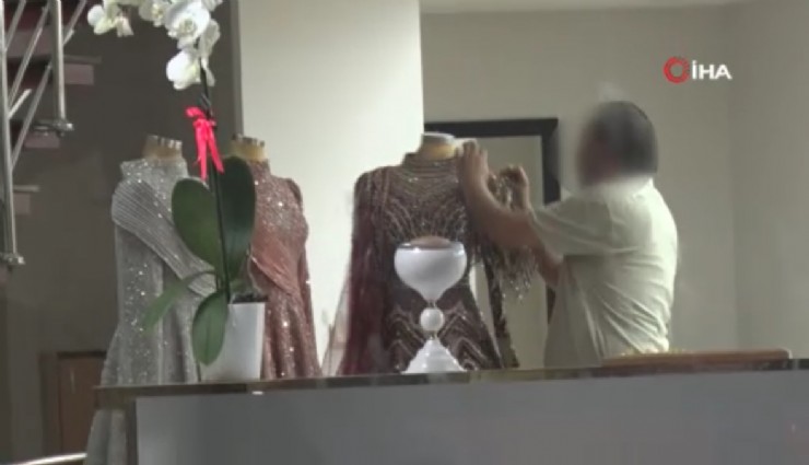 Eşinin mağazasına girip gelinliklerin üzerlerine kolonya döktü, tüpe çakmağı dayayınca tazyikli suyu yedi